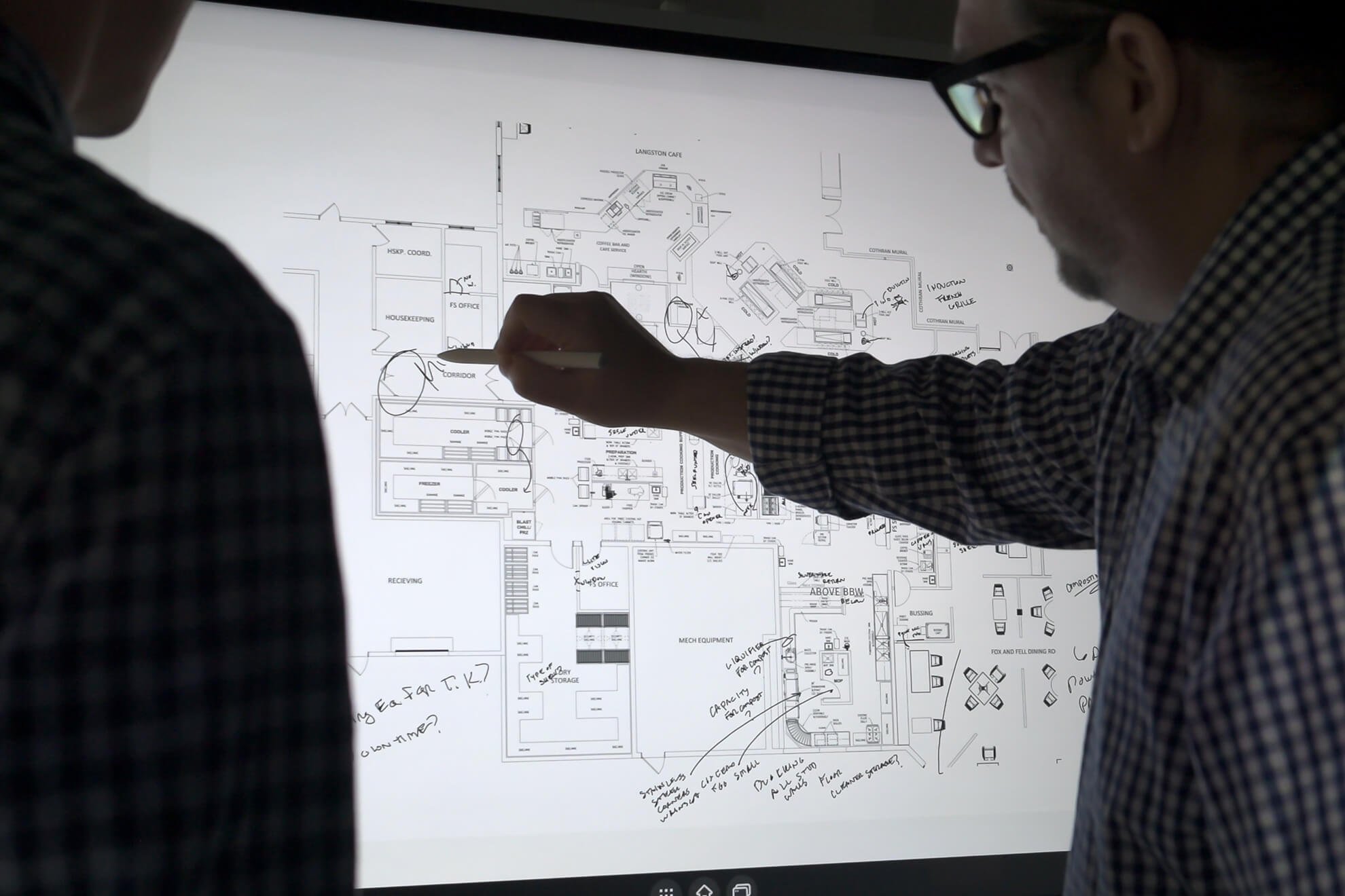 A client and architect reviewing their plans on the Vibe Board